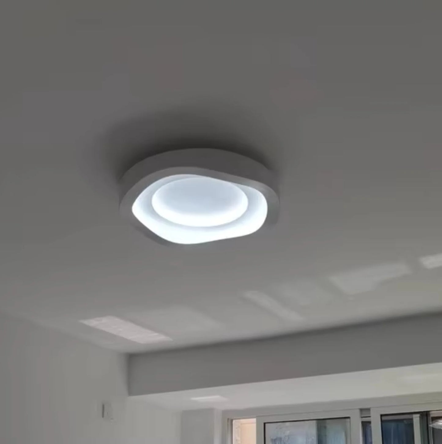 wall light on a ceiling wih window