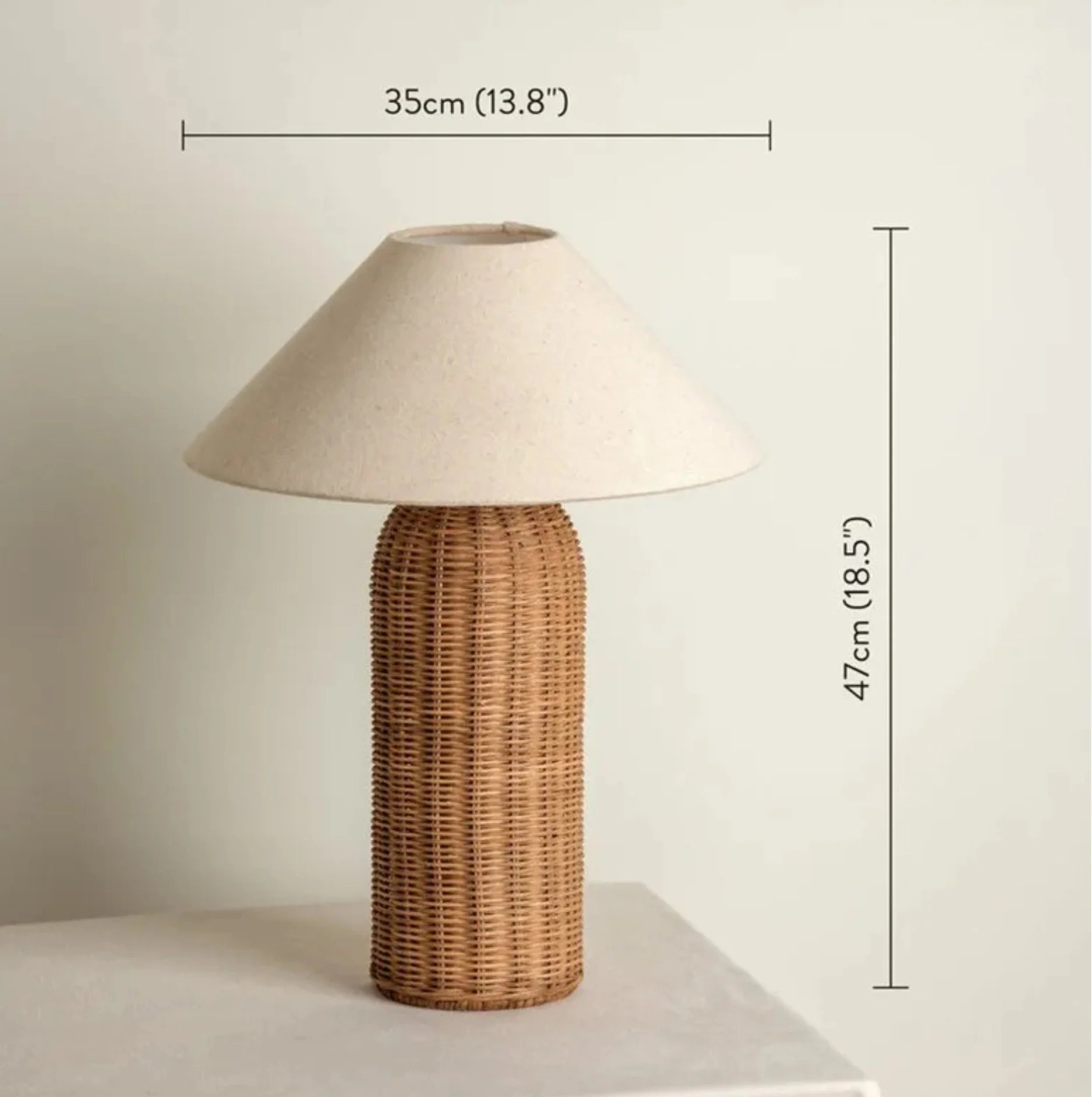 Table lamp with wicker base and beige lampshade, shown with measurements on a plain background.