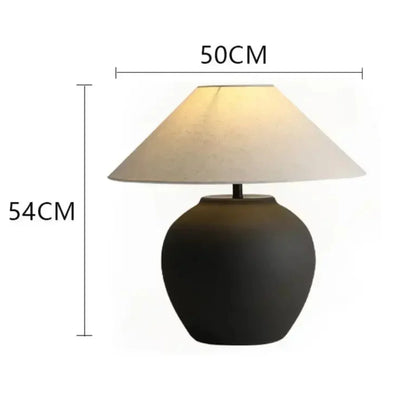 Table lamp with dimensions indicated on a white background larger