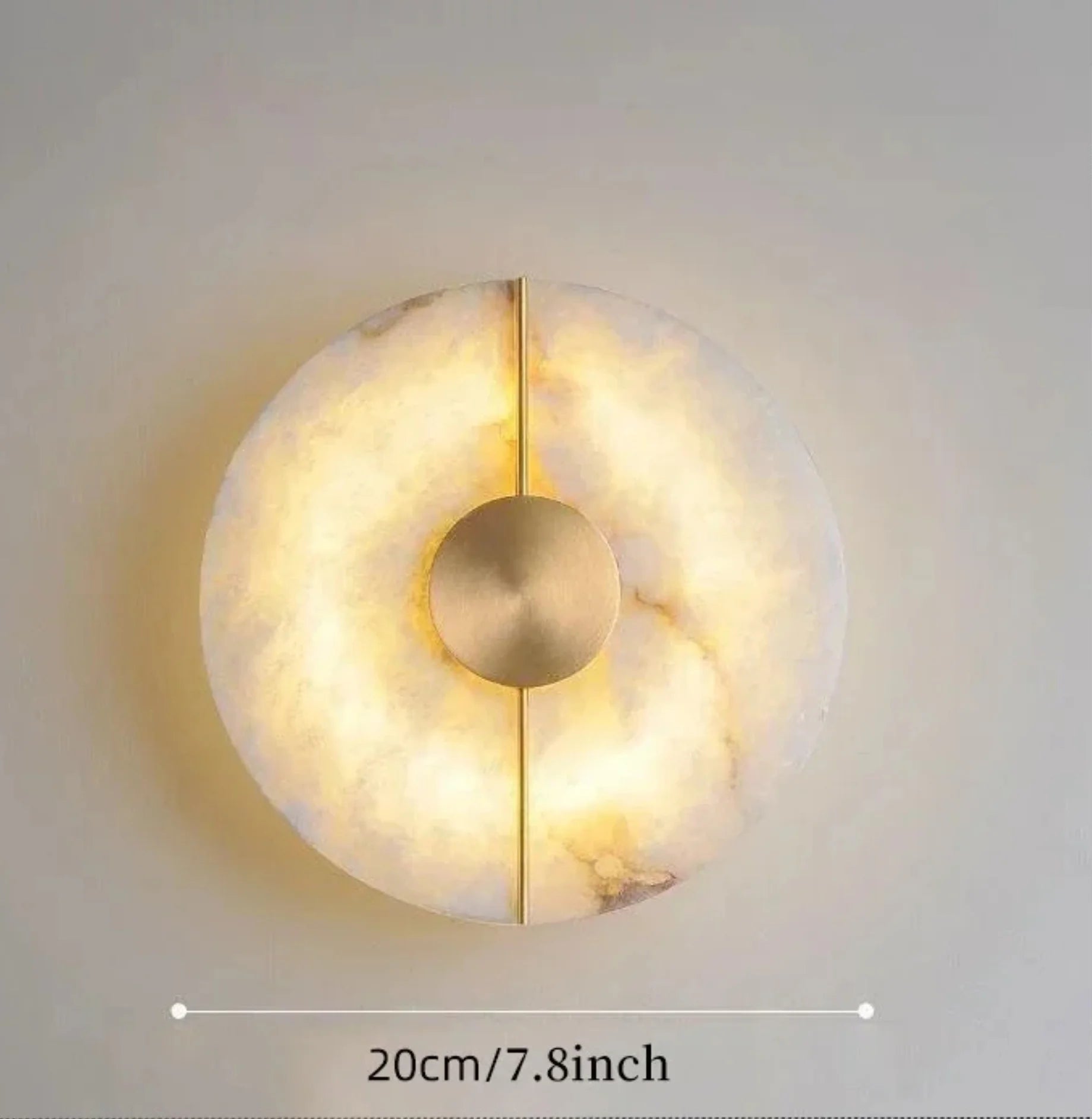 Decorative wall light with marble-like texture and gold accent on a neutral background